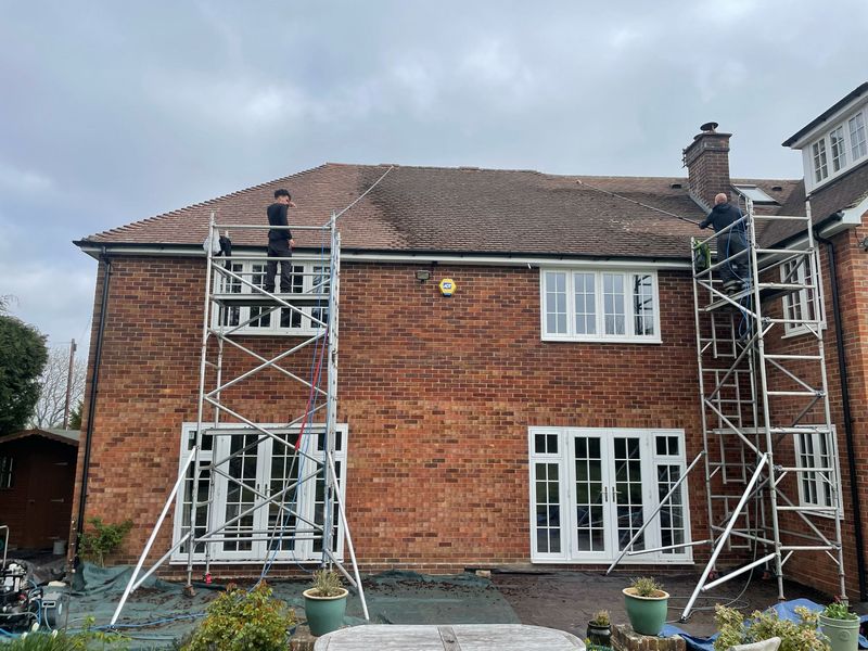 Roof cleaning carried out safely from scaffold towers by The Roof Moss Cleaners in Netley